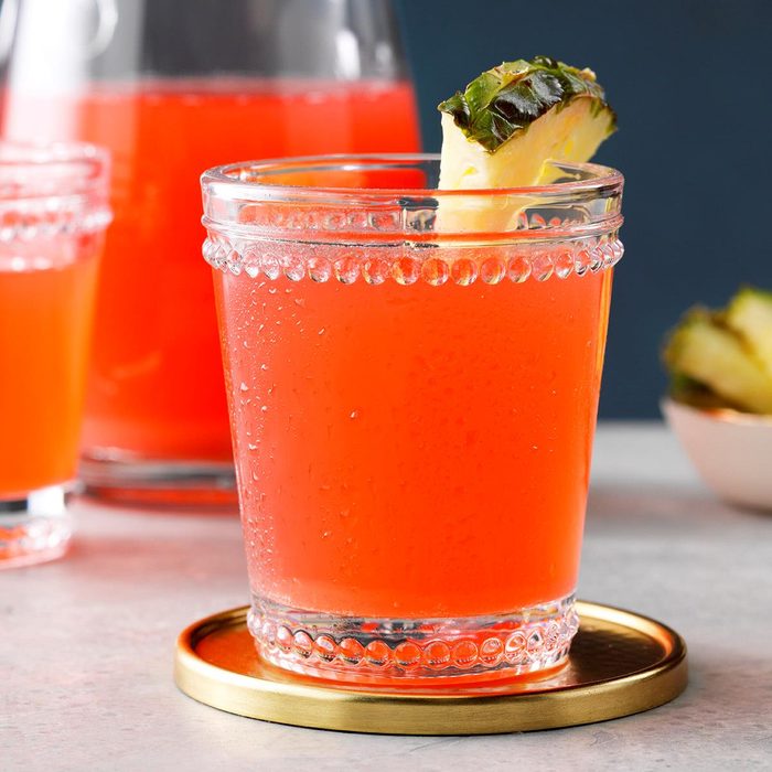 a glass of pink rhubarb punch