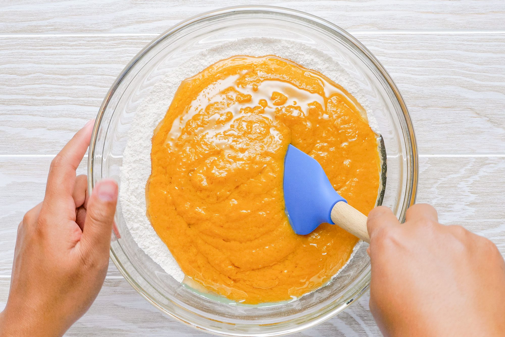 Mixing Ingredients in a Large Glass Bowl to Make Batter for Pumpkin Bread