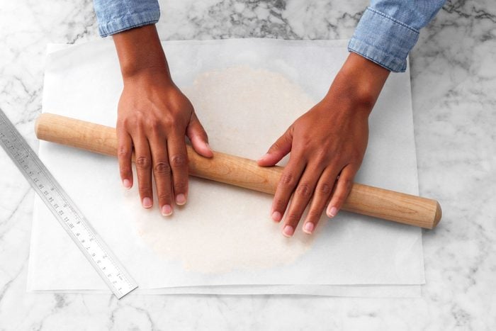 A Person Rolling a Rolling Pin