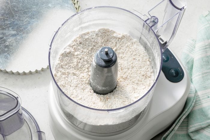 flour, pecans, butter, confectioners' sugar and salt in a food processor