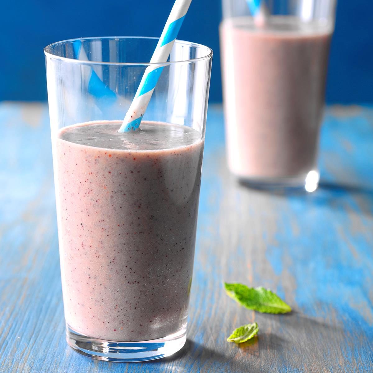 so-healthy smoothie in a glass with a paper straw