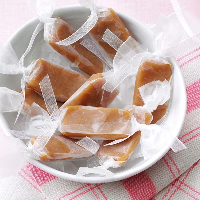 A bowl of wrapped, homemade caramel candies.