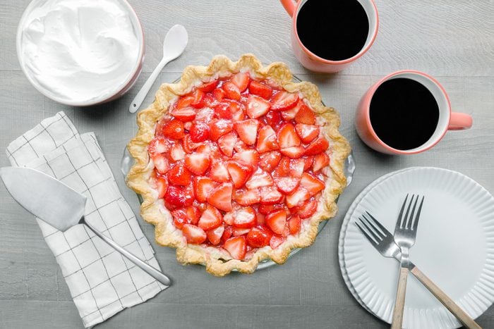 Strawberry Cream Cheese Pie served with coffee and whipped cream