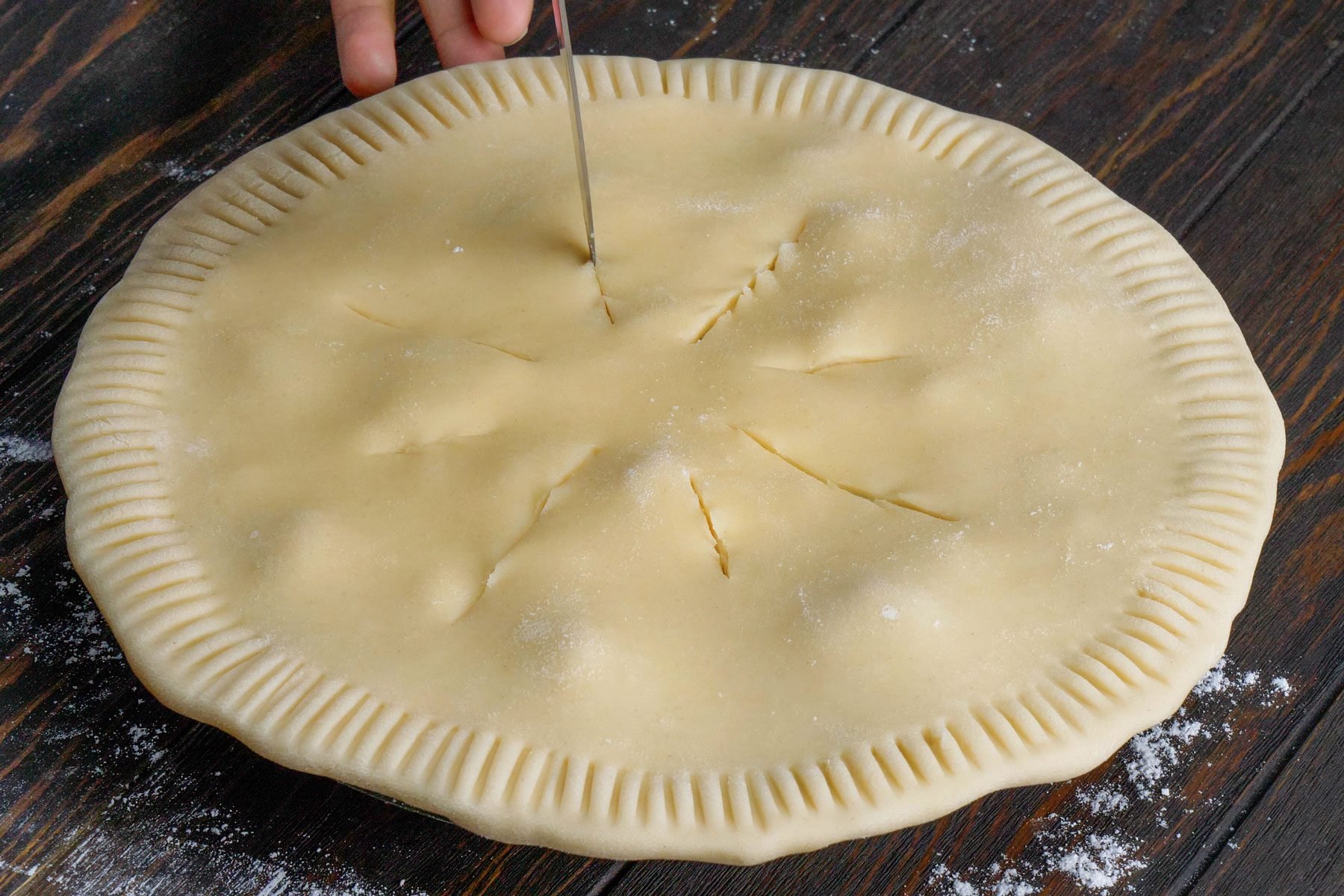 Cut slits in the center of the pie crust with a knife