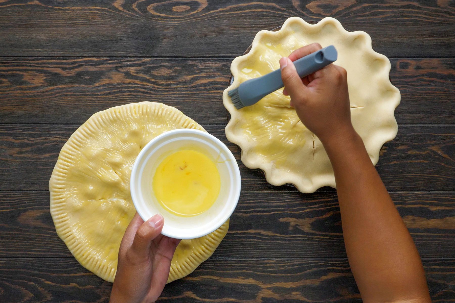 Pie crust is brushed over with egg yolk and butter to make Turkey Potpies