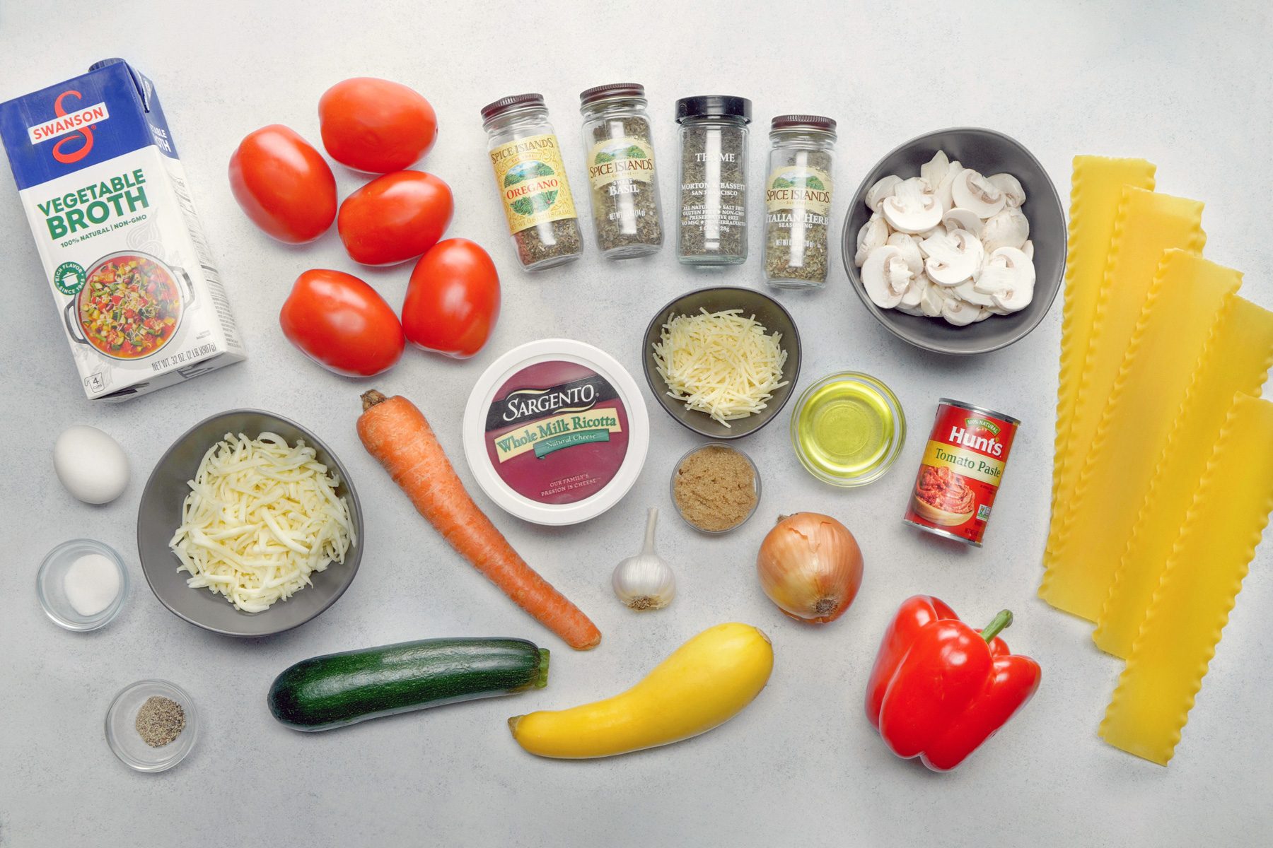 The Ingredients For a Vegetable Lasagna are Laid Out on a Table