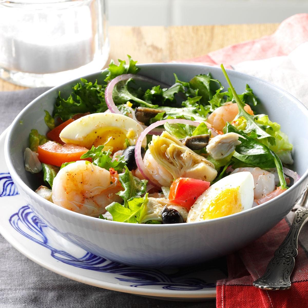 Seasoned shrimp salad with eggs and fresh mixed greens