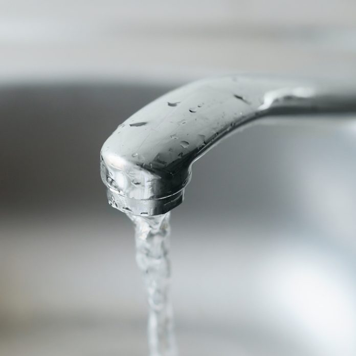 Metal tap with running water