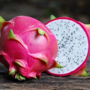 Dragon Fruit On old Wooden Table