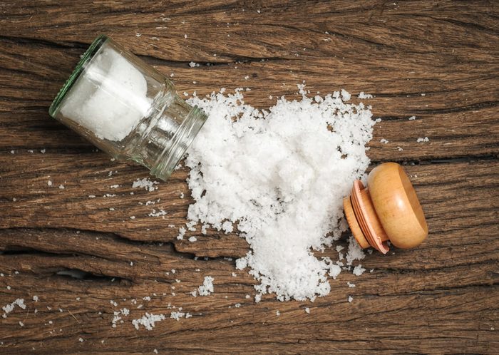 salt sprinkled on wooden table