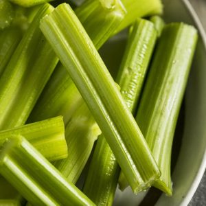 Raw Organic Green Celery Stalks with Ranch Dip