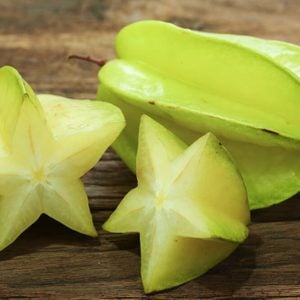 Star fruits on wooden table.