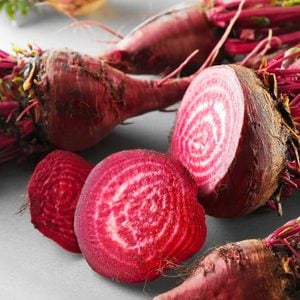 Fresh young sliced beets on table