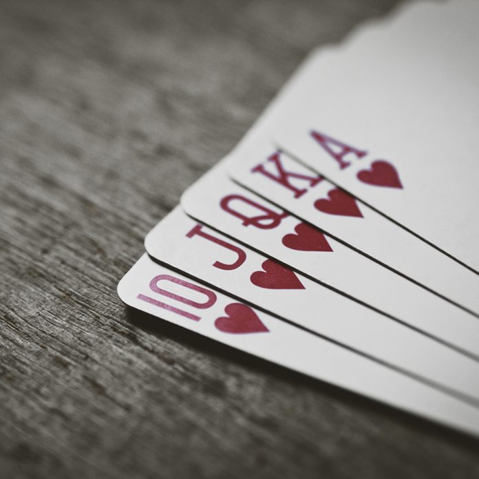 Closeup of heart royal flush the highest ranking hand in hold'em poker in horizontal view. Money win abstract. Risk game.; Shutterstock ID 546898006; Job (TFH, TOH, RD, BNB, CWM, CM): TOH