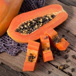 Papaya on wooden background.