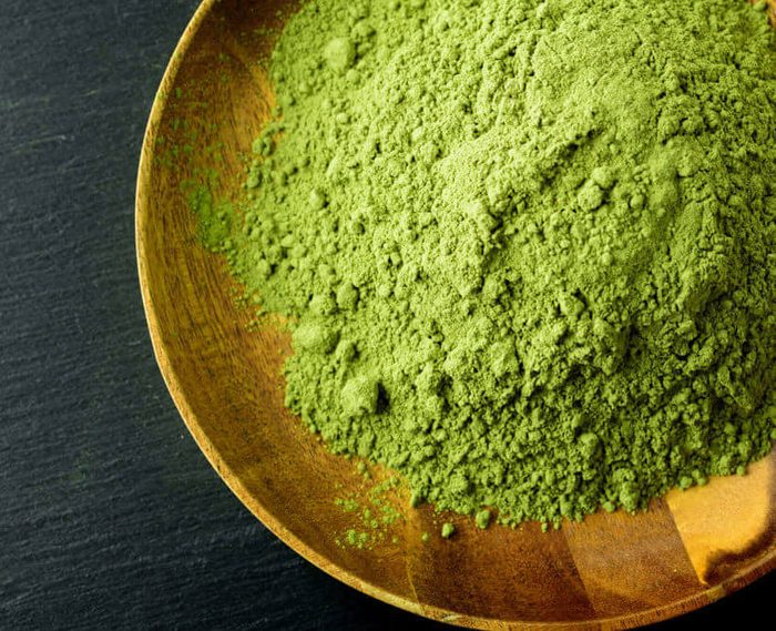 Japanese green tea matcha in a wooden bowl