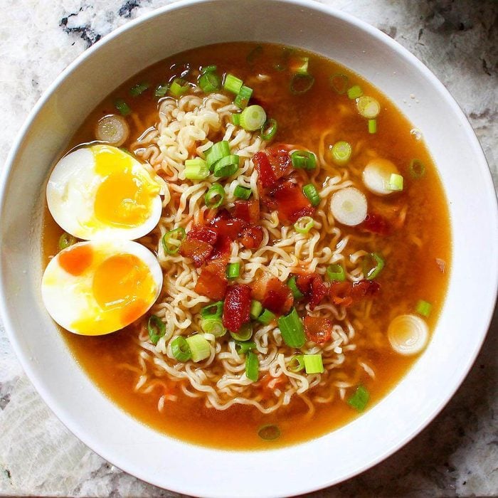 Ramen topped with an egg and bacon