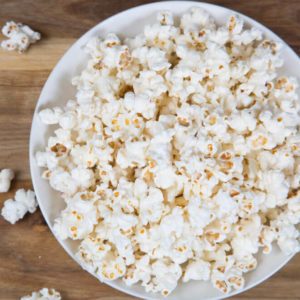Fresh homemade popcorn in a white bowl