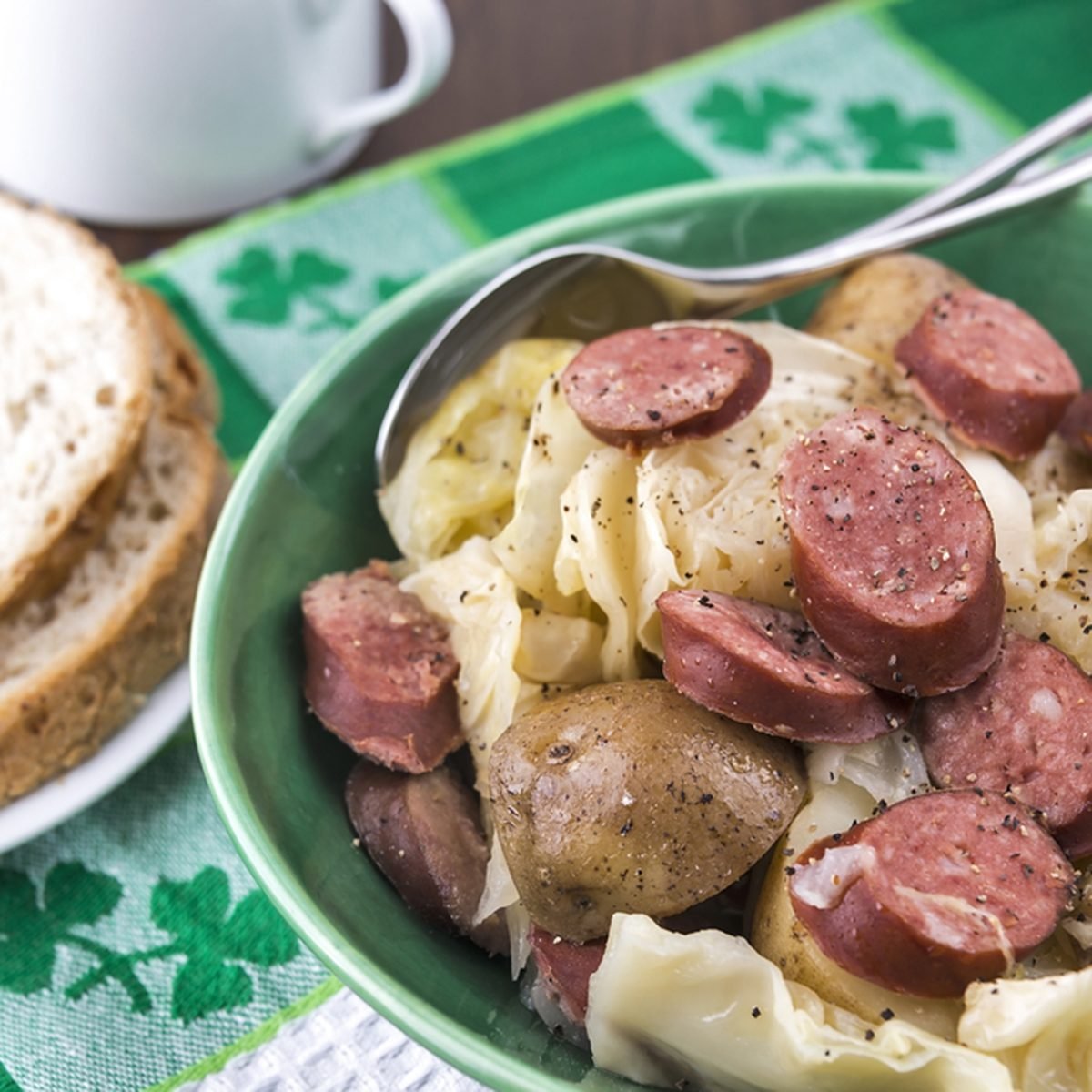 Slow cooked cabbage, potatoes &amp; smoked sausage with bread; Shutterstock ID 158423129