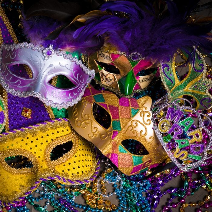 A group of venetian, mardi gras mask or disguise on a dark background; Shutterstock ID 247615072