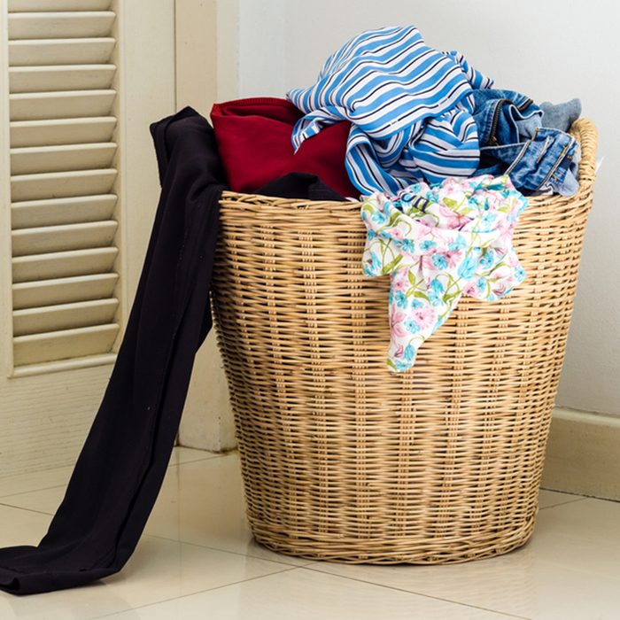 Pile of dirty clothes in a washing basket; Shutterstock ID 410632486