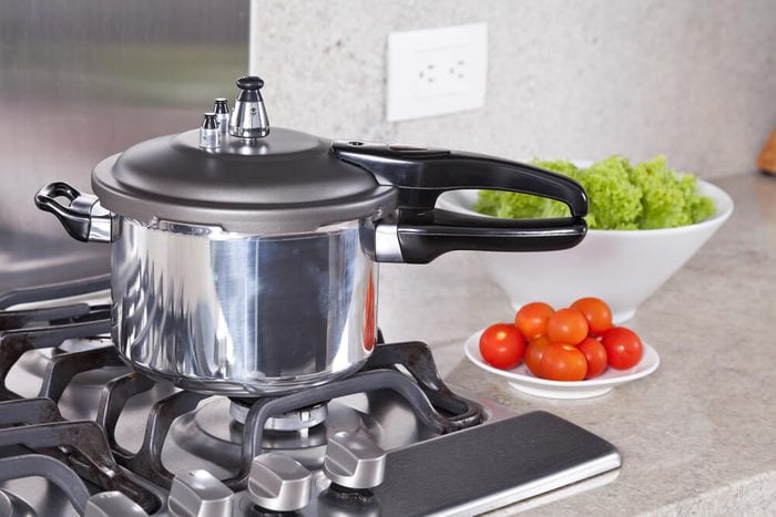 double valve pressure cooker, in a Kitchen setting;