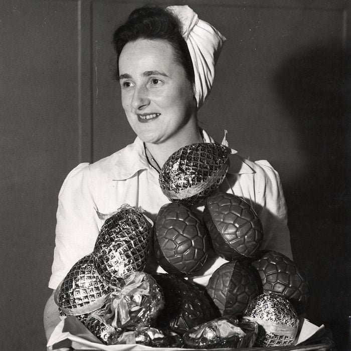 Mandatory Credit: Photo by ANL/Daily Mail/REX/Shutterstock (882983a) A Woman Pictured With A Pile Of Easter Eggs. A Woman Pictured With A Pile Of Easter Eggs.