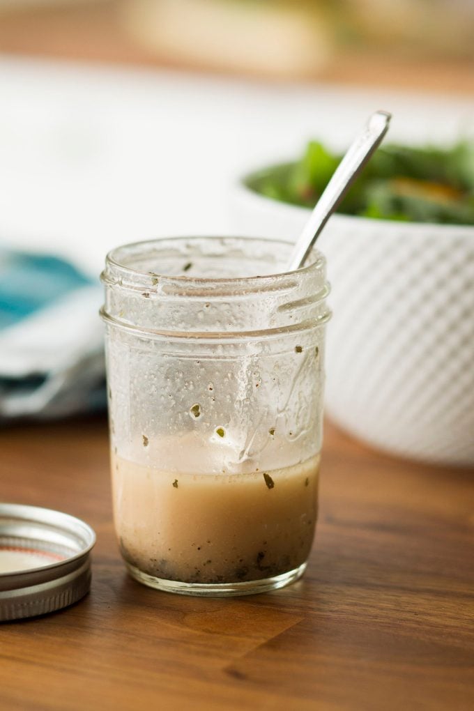 Simple vinaigrette in Mason jar.