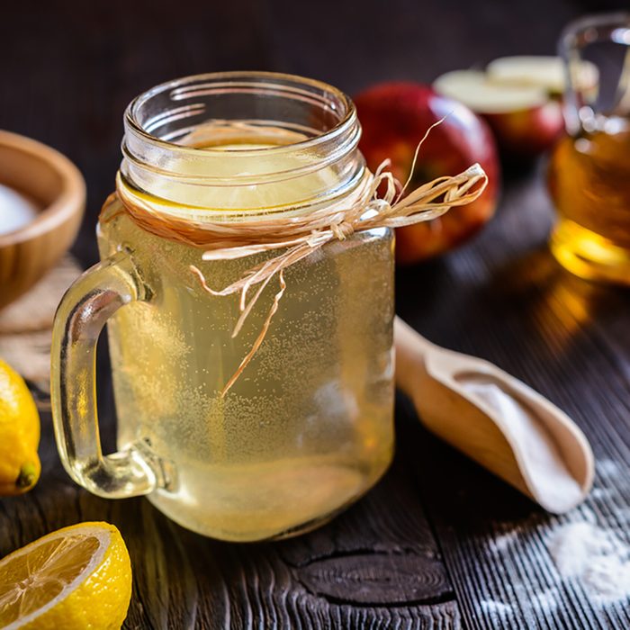 Detox drink made of water, apple cider vinegar, lemon juice and baking soda; Shutterstock ID 580918609