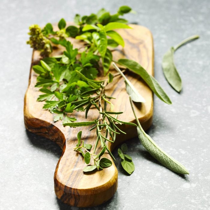 Herbs on cooking board