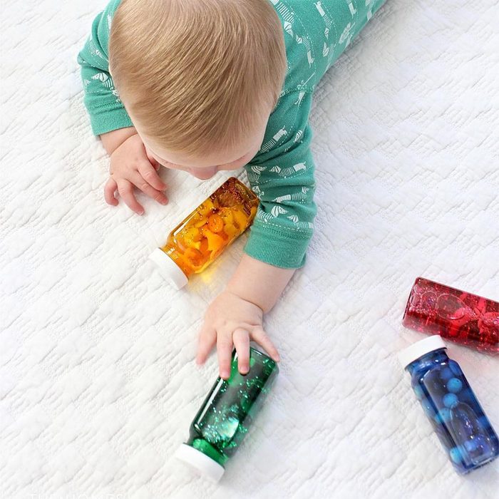 Baby playing with rattles