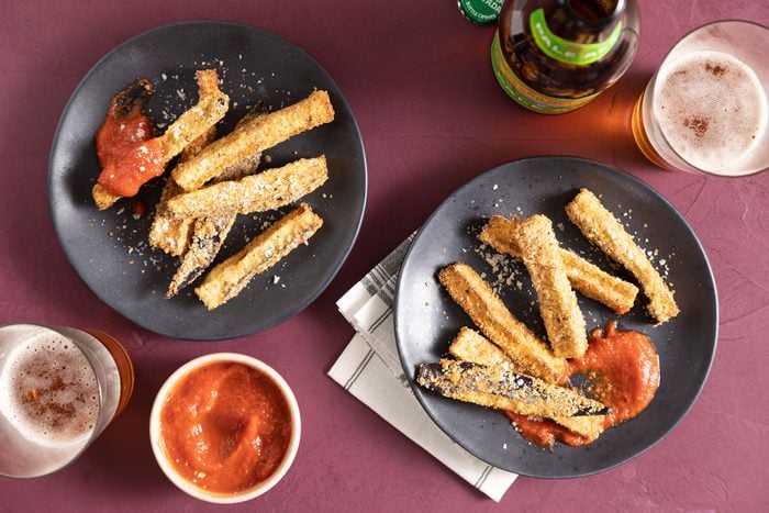 Air Fryer Eggplant Fries on Plate with Sauce and Drinks