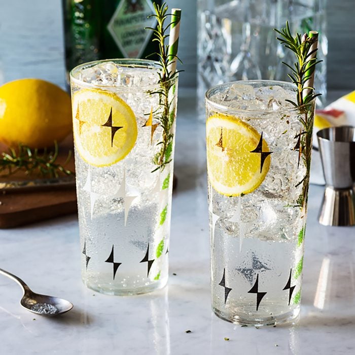 Rosemary Lemon Gin Fizz Alcoholic Cocktail on Bar with Ingredients; Shutterstock ID 362843429