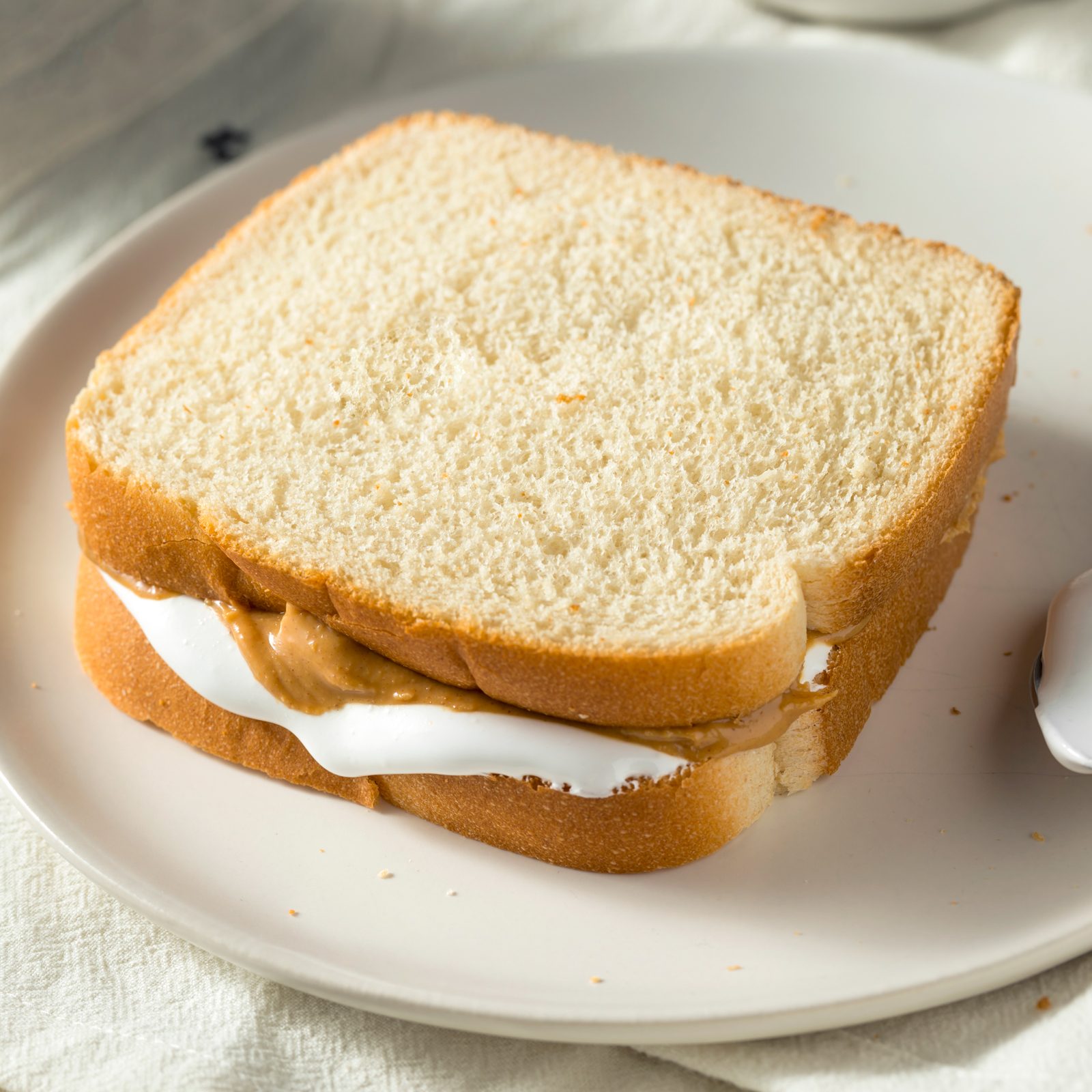 peanut butter and marshmallow fluff sandwich on sliced white bread