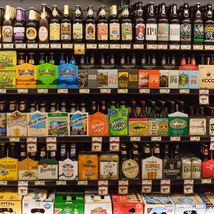 HOSTON,US-JUN 25,2016:Various bottles of craft, microbrews, IPAs, domestic and imported beer beers from around the world on shelf display in supermarket.Alcohol drinks background, different beer style; Shutterstock ID 446130109