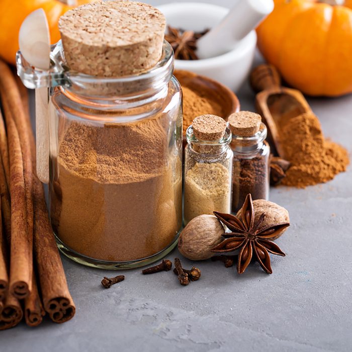 Homemade pumpkin pie spice in a glass jar with ingredients; Shutterstock ID 461456947