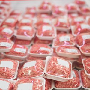 Variety of beef forcemeat in boxes in supermarket;