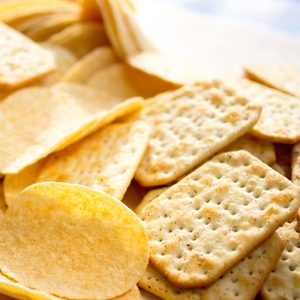 Chips and crackers scattered on the table