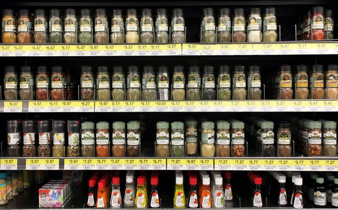 Various spices and seasoning powders on shelves in a supermarket. McCormick is one of the main manufactures spices, herbs, and flavorings in the world.