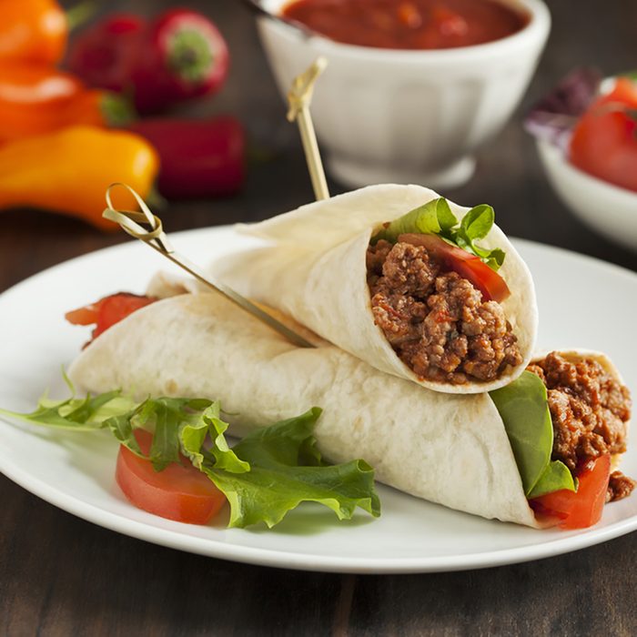 Burritos filled with meat and vegetables.