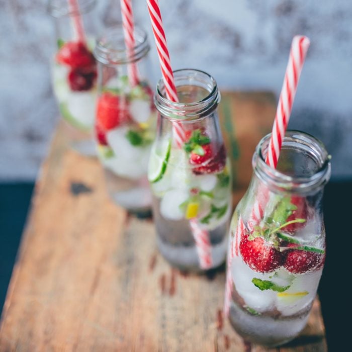 Refreshing infused water summer drinks with strawberries and lime