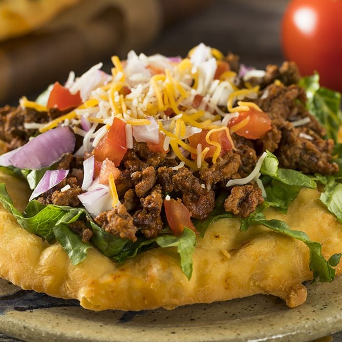 Homemade Indian Fry Bread Tacos with Ground Beef Lettuce and Tomato