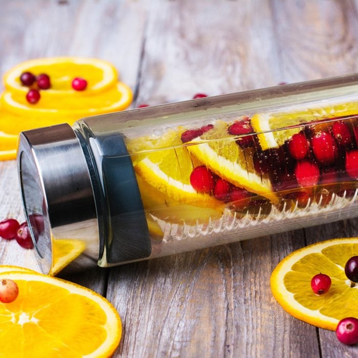 Summer refreshing detox infused water with cranberry and oranges