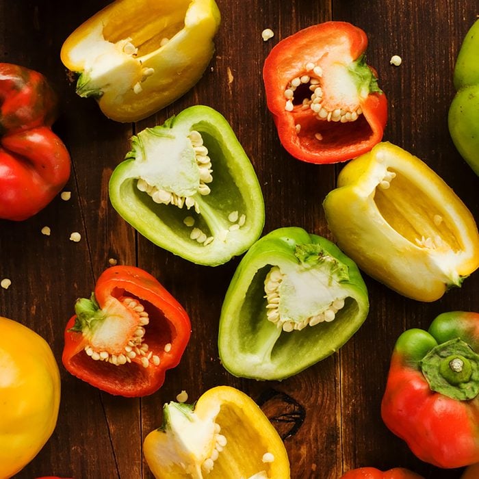 Group of colorful peppers on the wooden background. Viewed from above.; Shutterstock ID 156793841; Job (TFH, TOH, RD, BNB, CWM, CM): Taste of Home