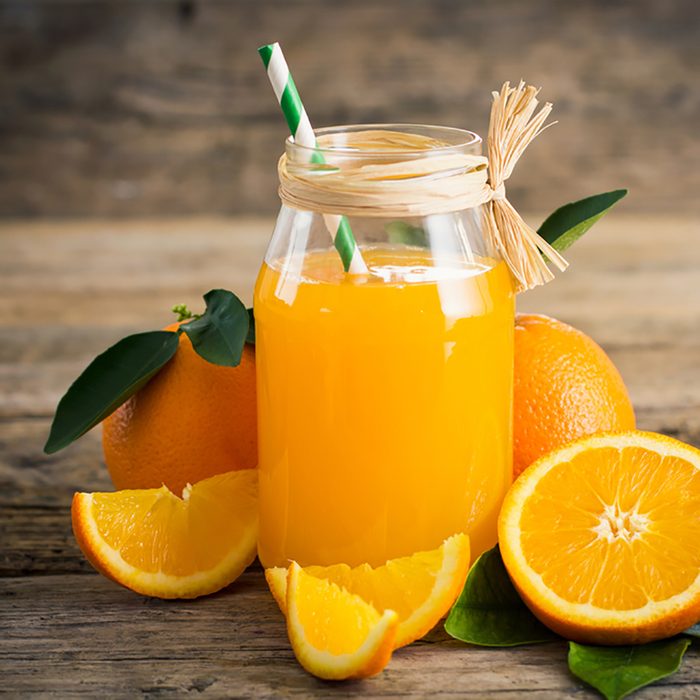 Fresh orange juice in the glass jar; Shutterstock ID 547801399