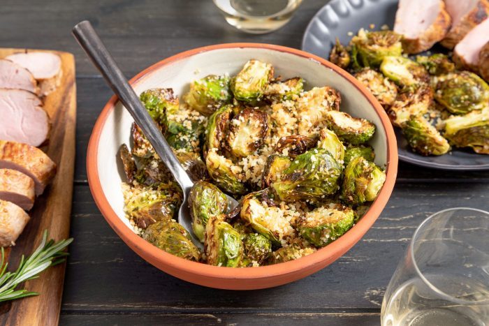 Air Fryer Brussels Sprouts in Terracotta Bowl on Wooden Surface