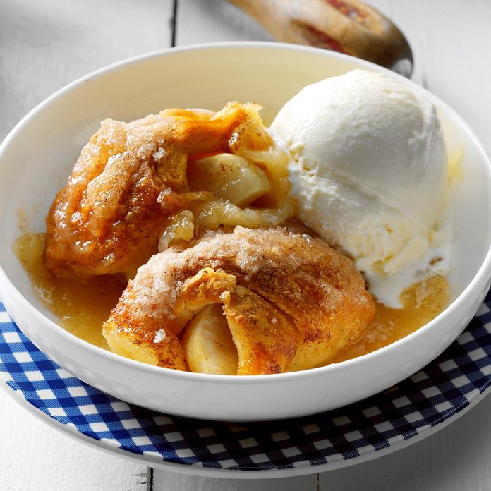 A bowl of Apple Dumpling Bake with melting vanilla ice cream