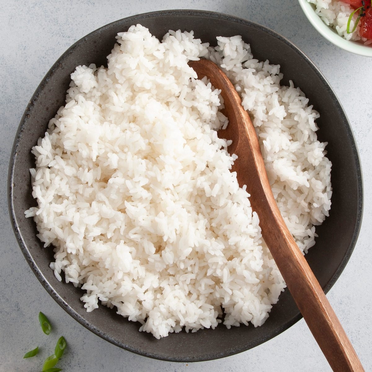 A bowl of fluffy, white cooked rice.