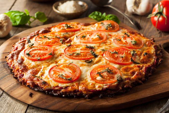Homemade Vegan Cauliflower Crust Pizza with Tomato and Basil; Shutterstock ID 409592167