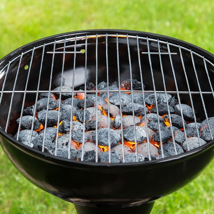 Empty grill with red-hot briquettes, close-up